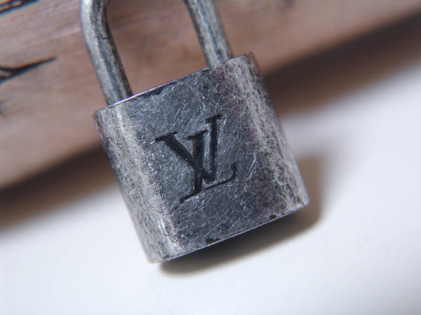 Louis Vuitton Padlock Marbled Silver-Tone Number 301