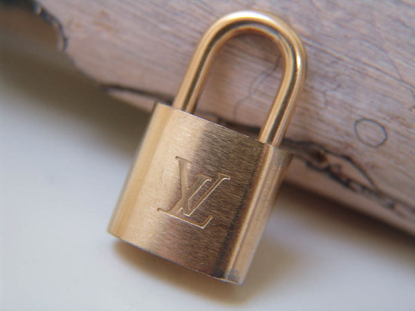 Louis Vuitton Padlock Brushed Gold-Tone Number 300