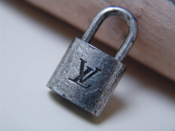 Louis Vuitton Padlock Marbled Silver-Tone Number 301